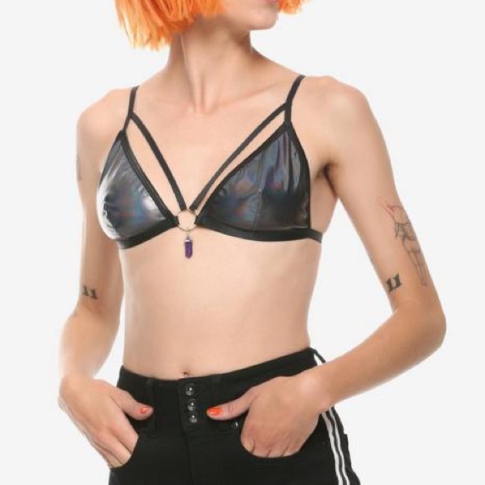 Hot topic bralette with a ring and crystal in the middle of the chest.